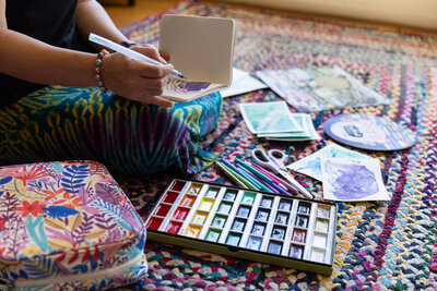 A-Baltimore-entrepreneur-paints-in-artist-loft-during-her-baltimore-brand-photoshoot-while-detailed-shots-were-taken-by-photographer-ingrid-berrios