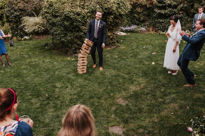 wedding guests at garden reception playing games