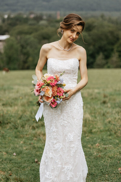 Bride holding her bouquet, UME (New England Wedding Planners) helped