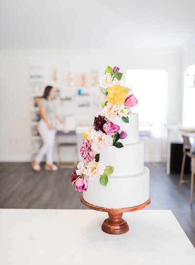 Styling a cascade of Gumpaste flowers On a wedding cake