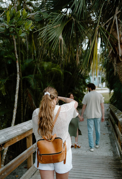Documentary style wedding photographer takes photo of couples during Sanibel Island, Florida engagement session.