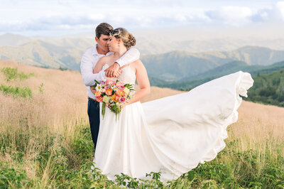 A couple enjoying their portraits at sunset while enjoying their destination wedding photography session by JoLynn Photography