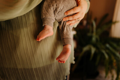 baby feet in onesie