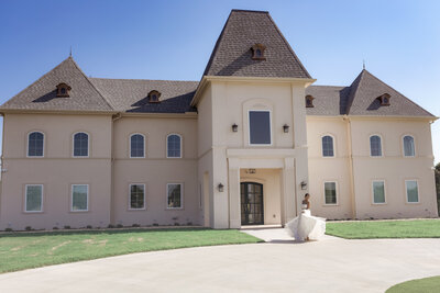 Bride twirling in front of Chateau Joli venue