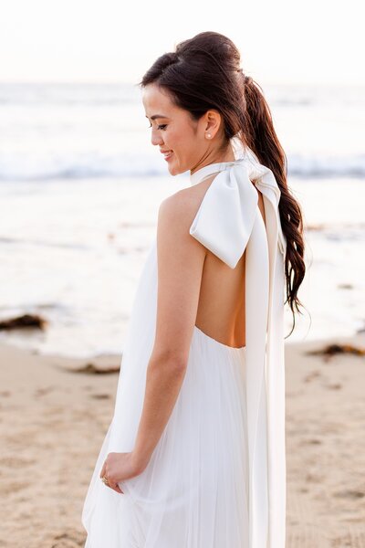 elegant bride wears chic wedding gown in Newport Beach
