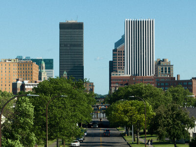 Cityscape with tall buildings and trees framing the skyline – photographed by wedding photographer Niko Coric – Lumen Clarity Media