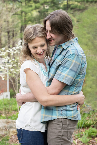 couple snuggling Asheville NC family photographer