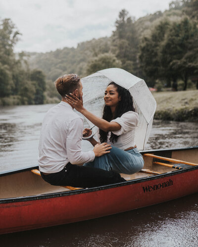 couple sitting on a canoe together