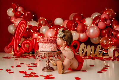 cake smash photographer cleveland ohio valentines day theme birthday balloon garland