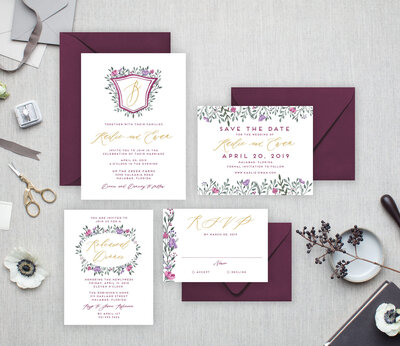 watercolor wedding invitations in shades of purple  with simple watercolor crest and monogram