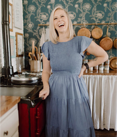 Leslie lauging in her kitchen