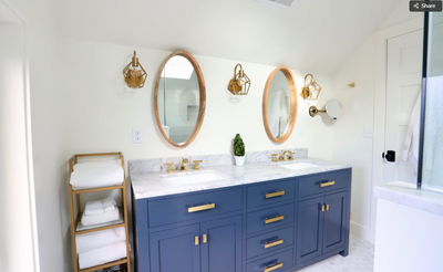 white and blue bathroom with gold finishes