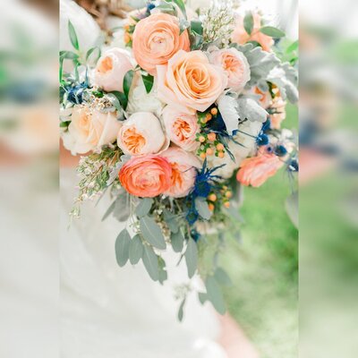 Pastel bouquet of peach, pink, green, and blue flowers