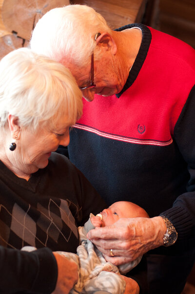 great grandparents holding newborn