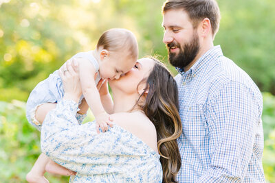 Mother kissing Infant Son with Father looking on by Alabama Photographer Amanda Horne