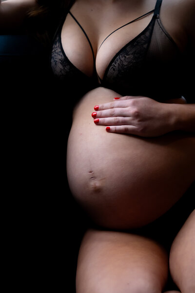 Pregnant belly with black lingerie