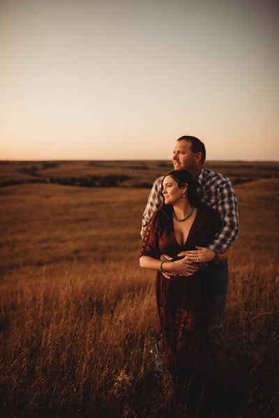 Nebraska couple hold onto each other during engagement session near Lincoln, Nebraska | Native Roaming