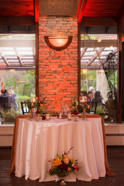 Picture of sweetheart's table at wedding reception