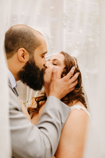 bride, groom, and two little boys standing together