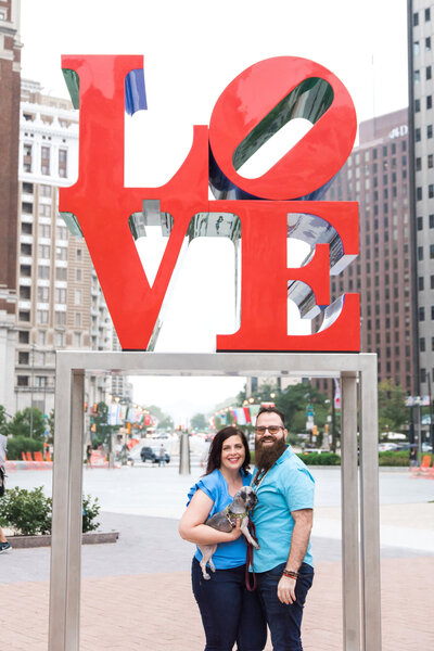 Couple in front of Love statue in Philadelphia