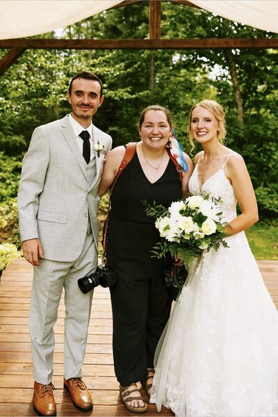 wedding photographer with bride and groom