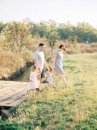 PNW Elopement Photographer captures young family holding hands and walking together