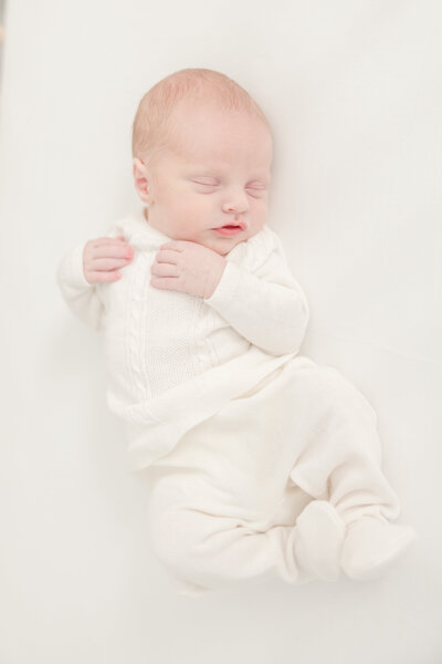Newborn Baby in white sweater -Newborn Photography Greenville SC