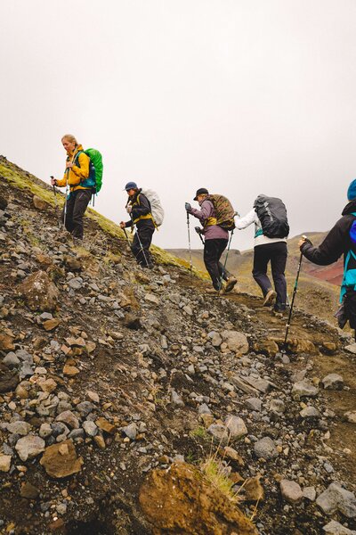 Women hiking up a mountain on a group hiking trip of the Laugavegur Trail in the Highlands of Iceland
