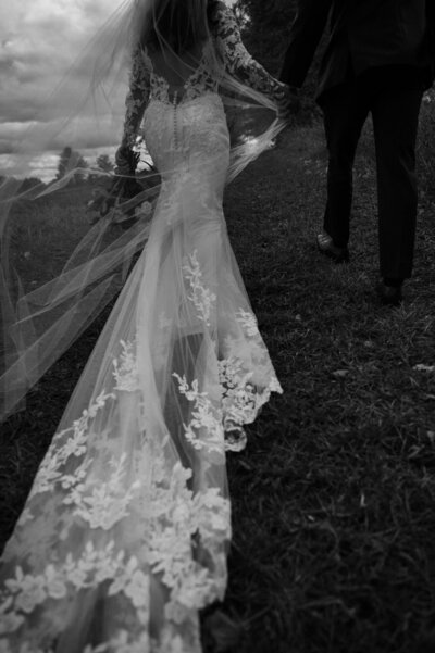 black and white photo of bride's lace wedding gown