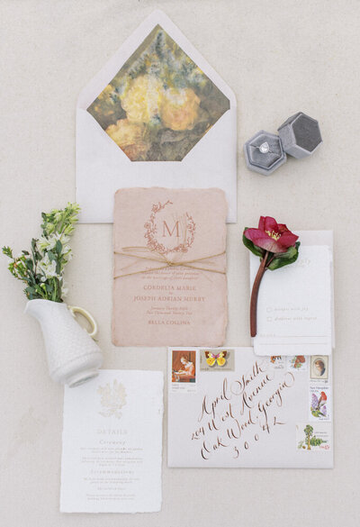 pink invitation and other wedding details