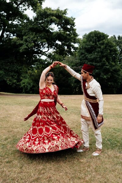 Indian wedding groom twirling bride