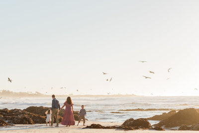Family at Asilomar Beach in Pacific Grove during sunset