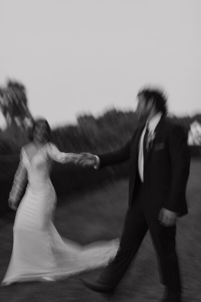 Blurry bride and groom during blue hour in charleston south carolina