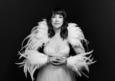 Brunette with white feather costume