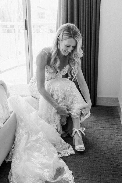 Bride putting on her shoes before the ceremony at the Sanctuary wedding venue