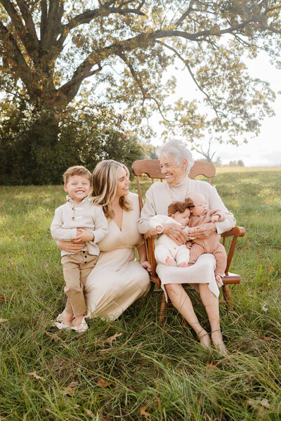 family sitting together in grass