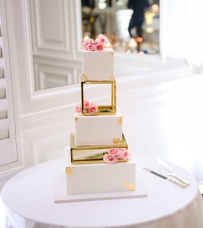 Wedding cake with gold details and pink flowers, Destination Wedding at The Palms Hotel in Miami, FL