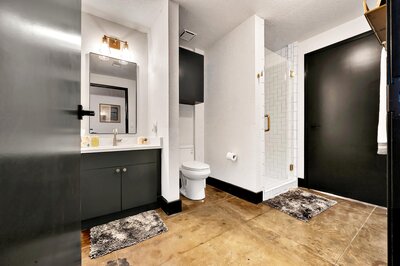 Bathroom in this two-bedroom, two-bathroom vacation rental condo in the historic Behrens building in downtown Waco, TX just blocks from the Silos, Baylor University, and Spice Street.