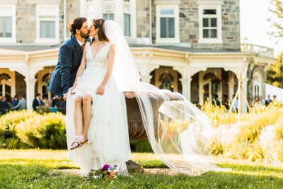 Couple kisses on the fountain at Cylburn Arboretum, Baltimore wedding photography