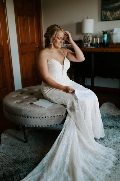 bride reading a personal letter from her groom before their elopement in Charlottesville virginia