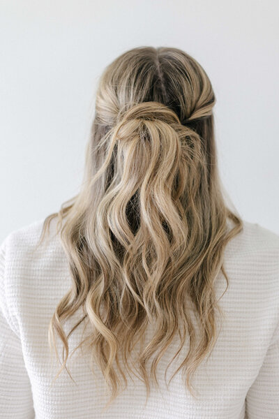 Voluminous blowout with big, bouncy curls styled for a glam finish.