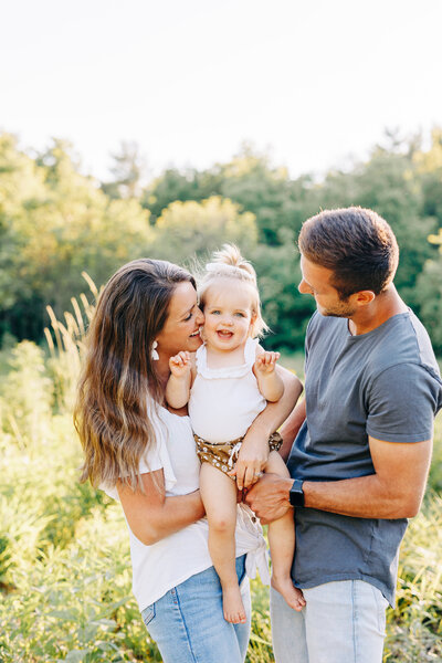 family of 3 with baby in the middle taken by a professional photographer