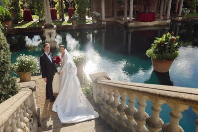 Celeste and Simon, byChenai couple, standing by the Boat House at Euridge Manor.
