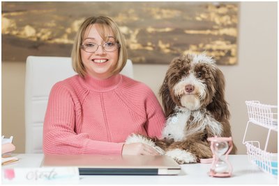Laura Lee and Cricket | woman in pink sweater with labradoodle