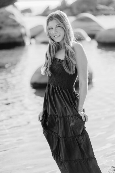 Truckee high senior girl at a portrait session at lake tahoe in a long blue dress, black and white image