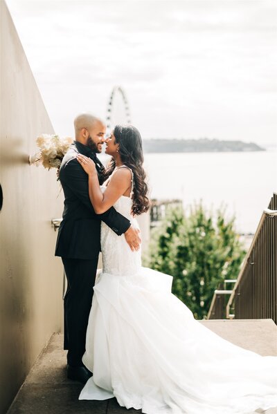 black wedding couple takes night time  photos on seattle rooftop