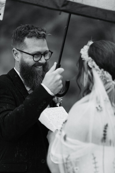 bride reads vows to groom in the rain
