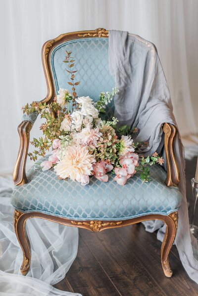 wedding-bouquet-on-blue-armchair
