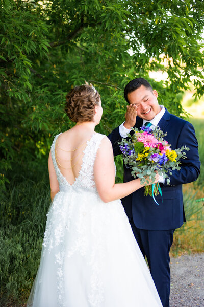 Jackson Hole photographers capture groom crying during first look before intimate elopement