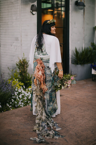Navajo Bride  shows off her custom wedding dress during her wedding at The Tinsmith in Madison, WI.